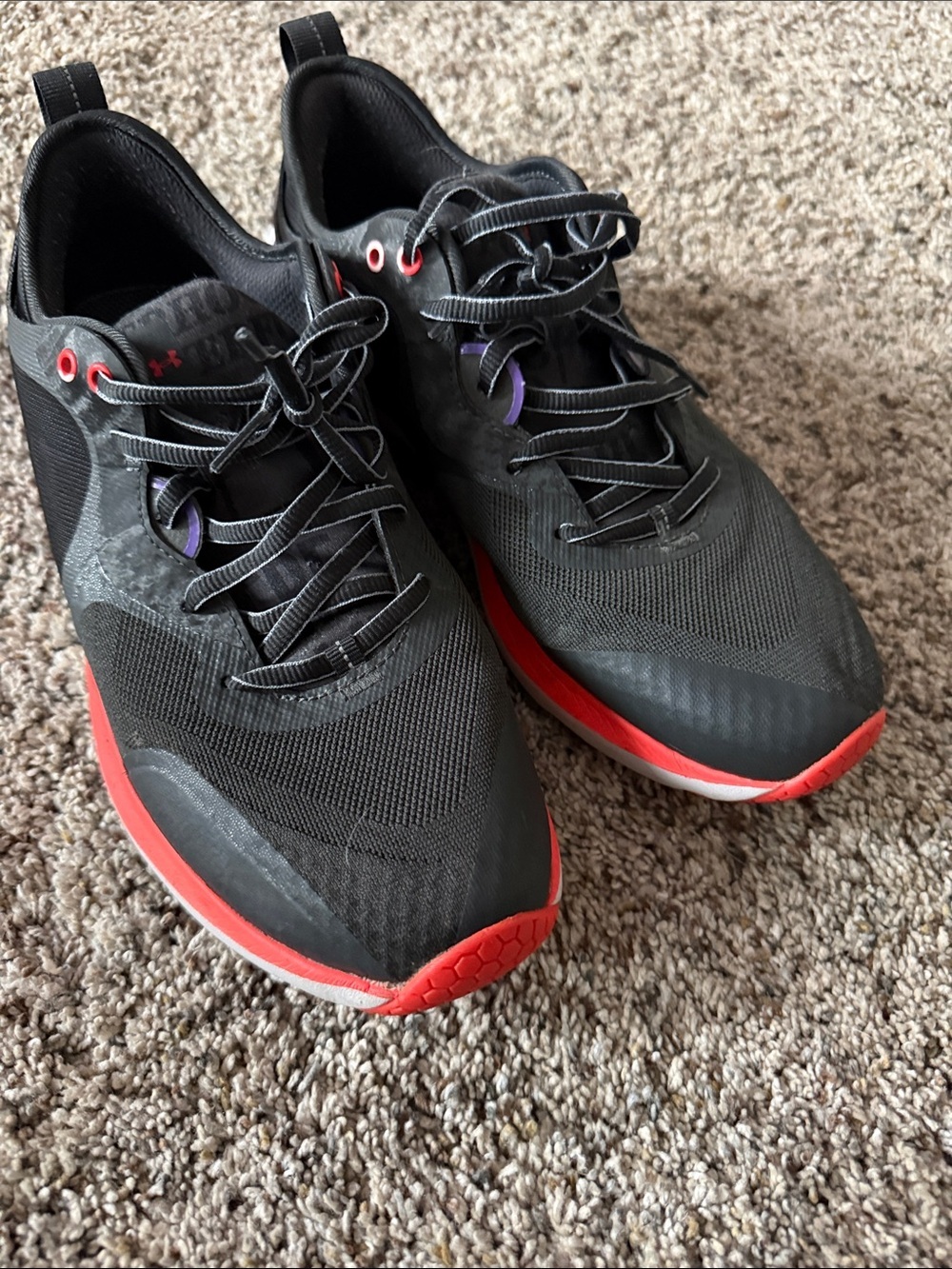 Under Armour Black Athletic Shoes with Orange Accents and Purple Eyelets